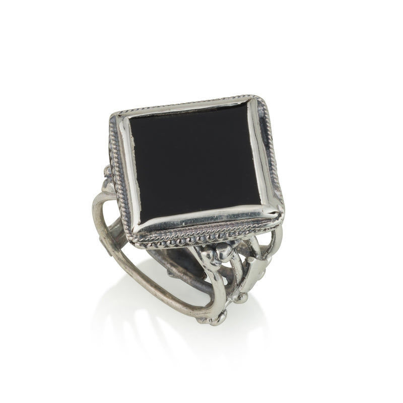 Silver ring inlaid with a rhombic and flat stone